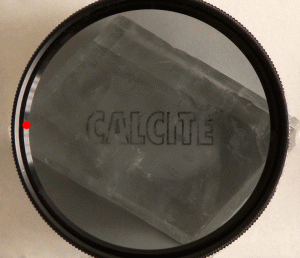 Calcite_and_polarizing_filter_Aldoaldoz.gif